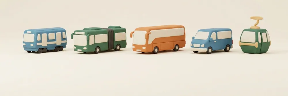 Clay models of a metro car, an articulated bus, a coach, a shuttle van and a gondola cabin